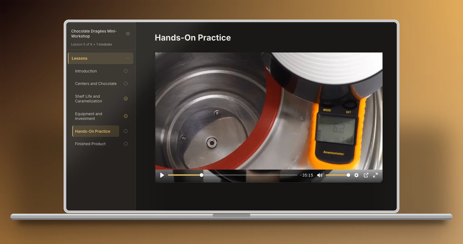 Real class inside the academy, lesson 5: an anemometer measuring the airflow at the mouth of the drum, with the reading on screen.
